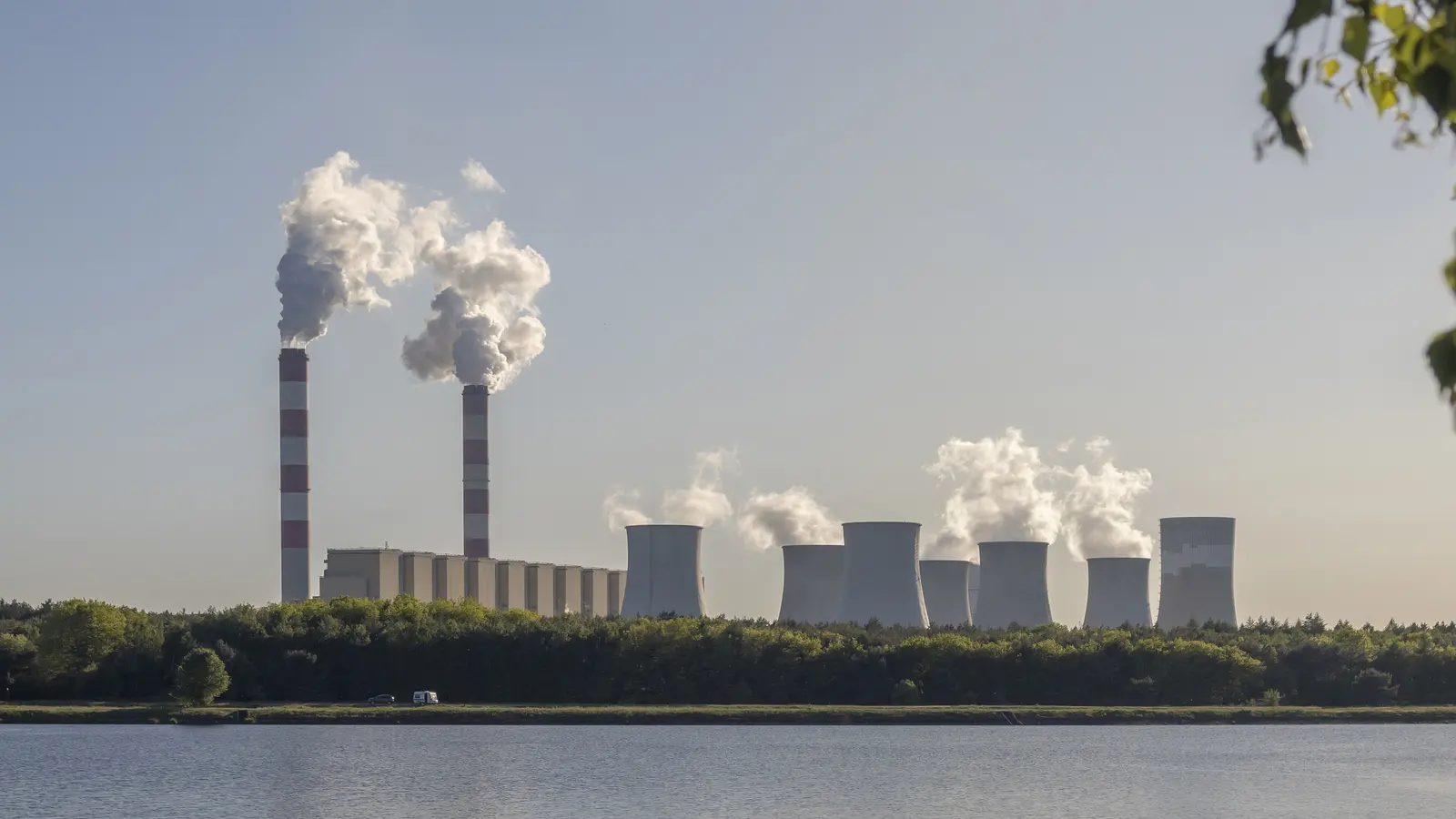 The Bełchatów coal power station in Poland, the largest single emitter in the EU Emissions Trading System, seen across the Słok reservoir.